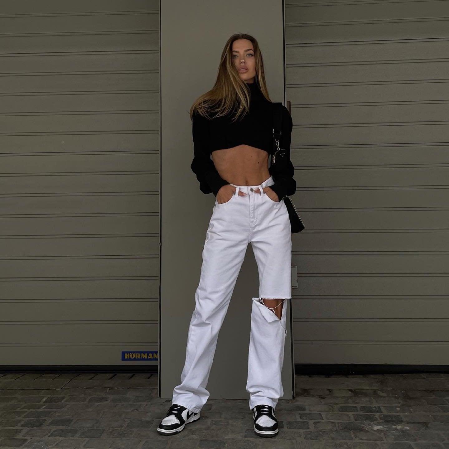 cropped black turtleneck top and ripped white jeans, casual look