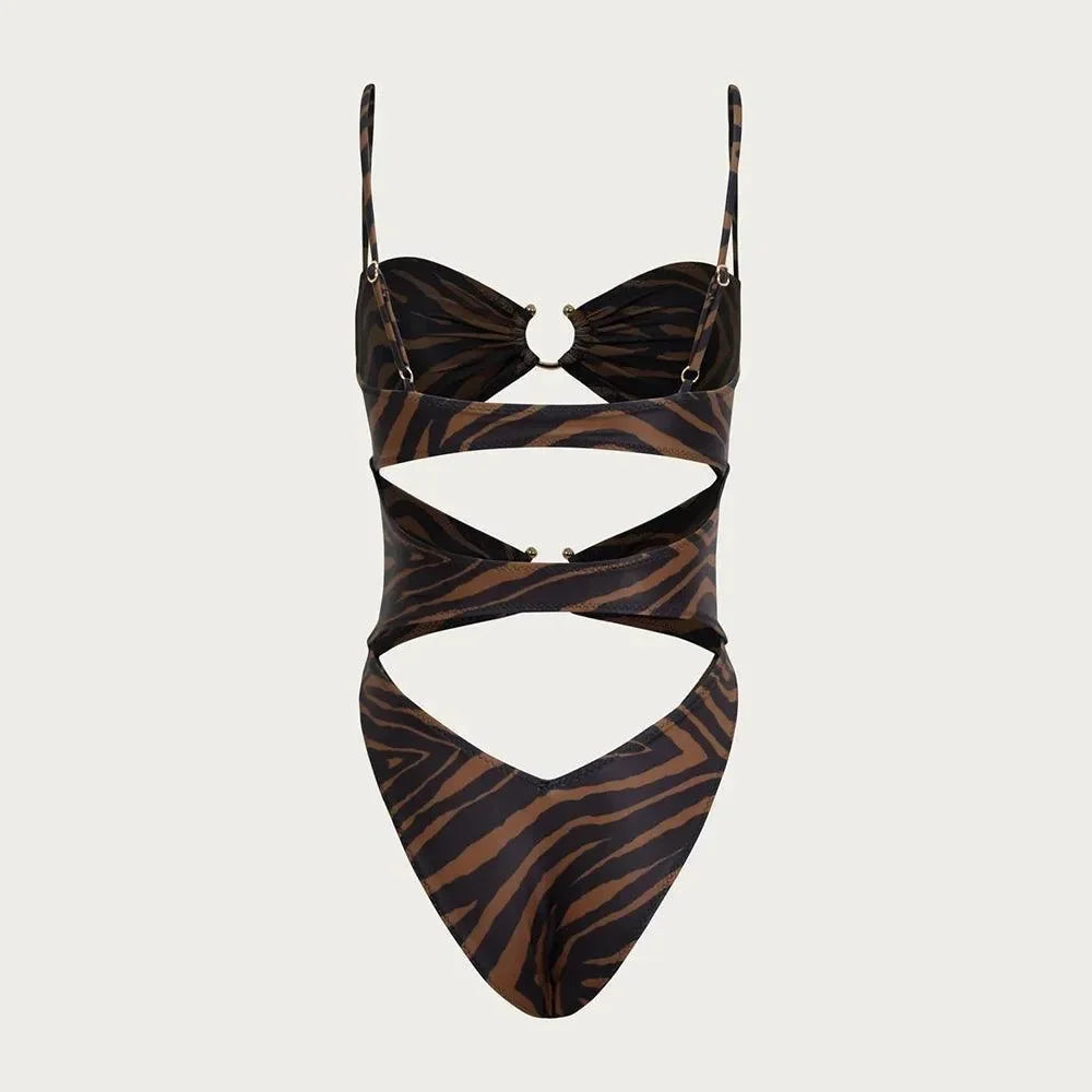 Zebra print cutout swimsuit with ring detail, bold swimwear style.