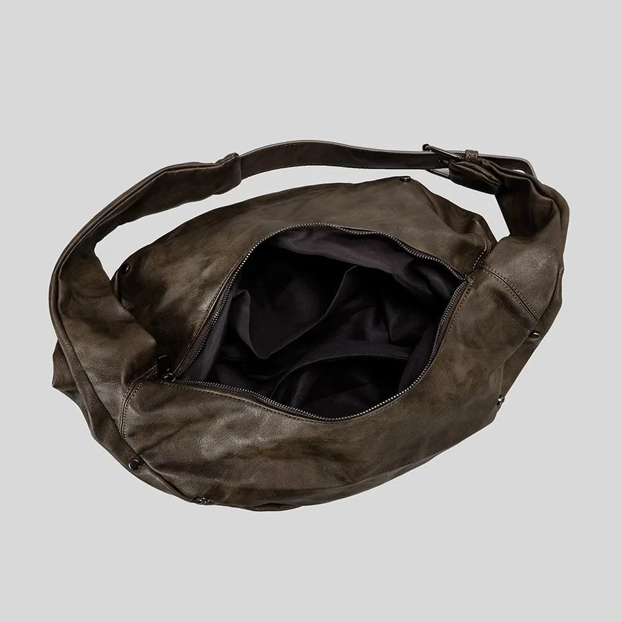 Dark brown leather hobo bag with spacious interior, versatile accessory for everyday use