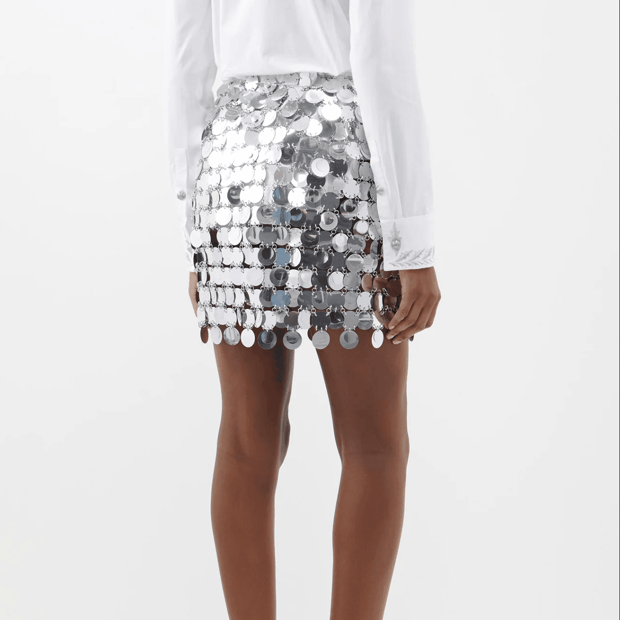 Sequin mini skirt with reflective discs, party and night-out style.