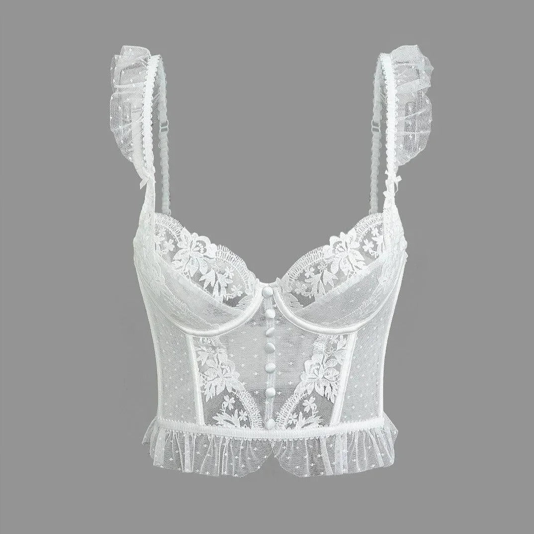 White lace cami top with ruffle trim and delicate floral details, styled with adjustable straps for a flattering fit.