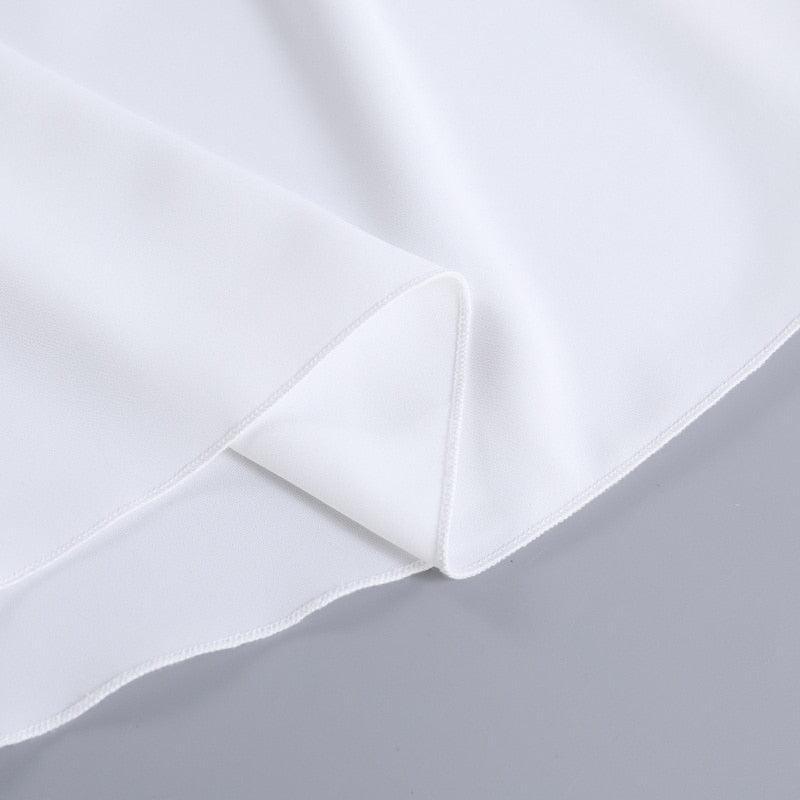 White satin fabric detail, potential for elegant garment creation.
