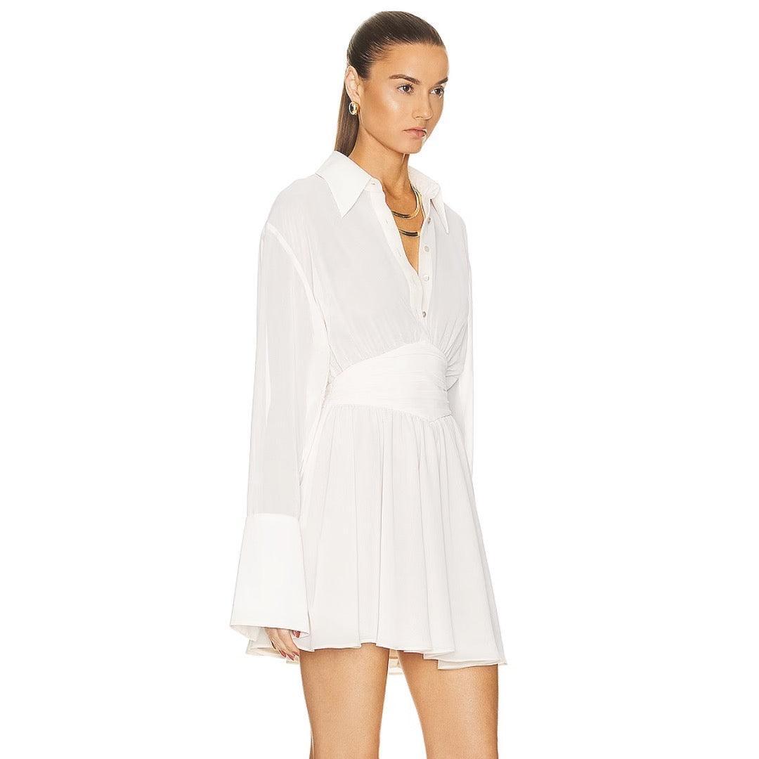 Long-sleeve pleated shirt dress, casual and elegant daytime look.