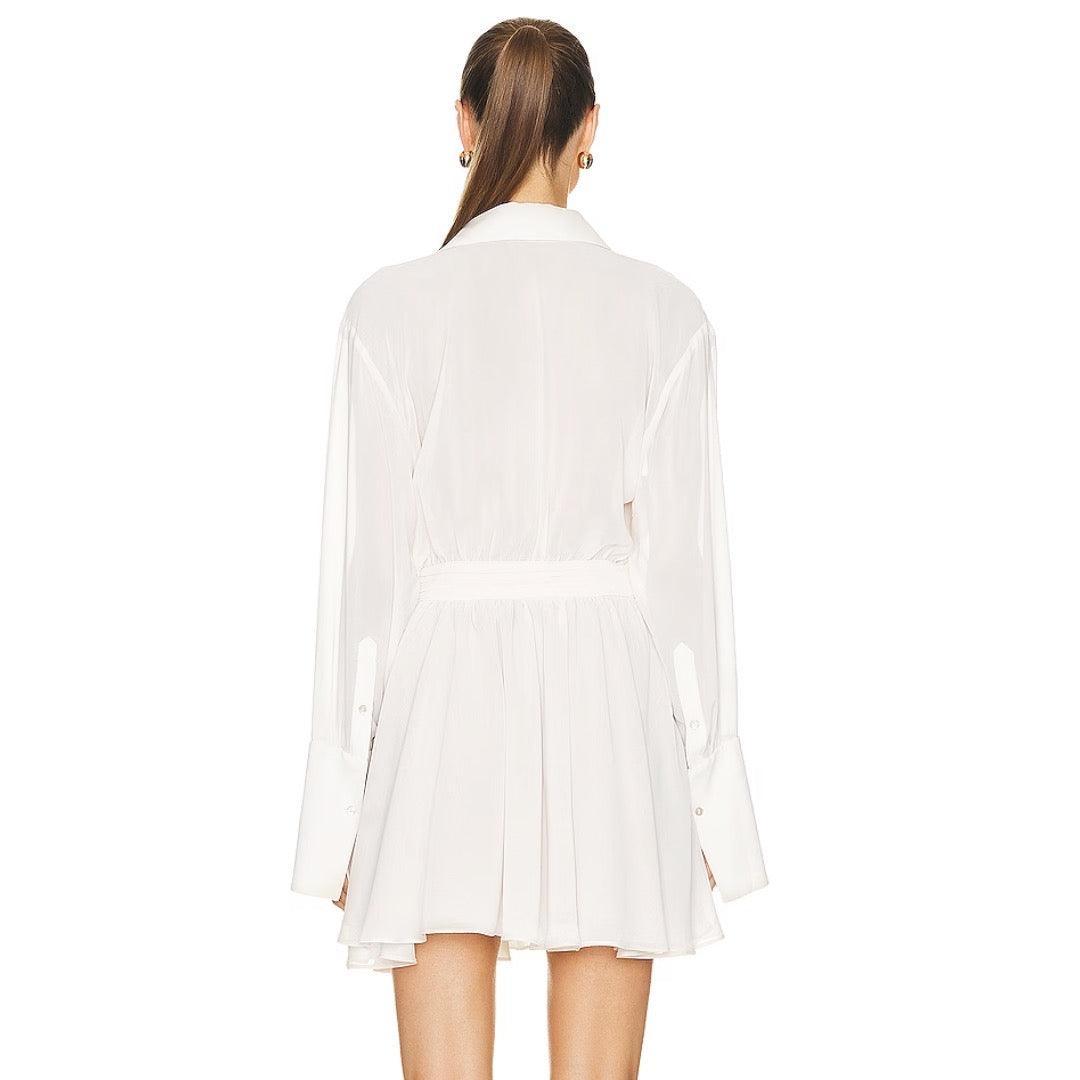 White pleated mini dress with long sleeves, elegant evening wear