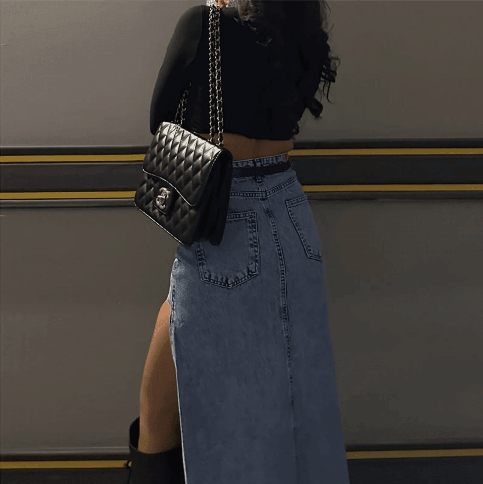 Denim maxi skirt with high slit, casual daywear outfit, quilted handbag accessory.
