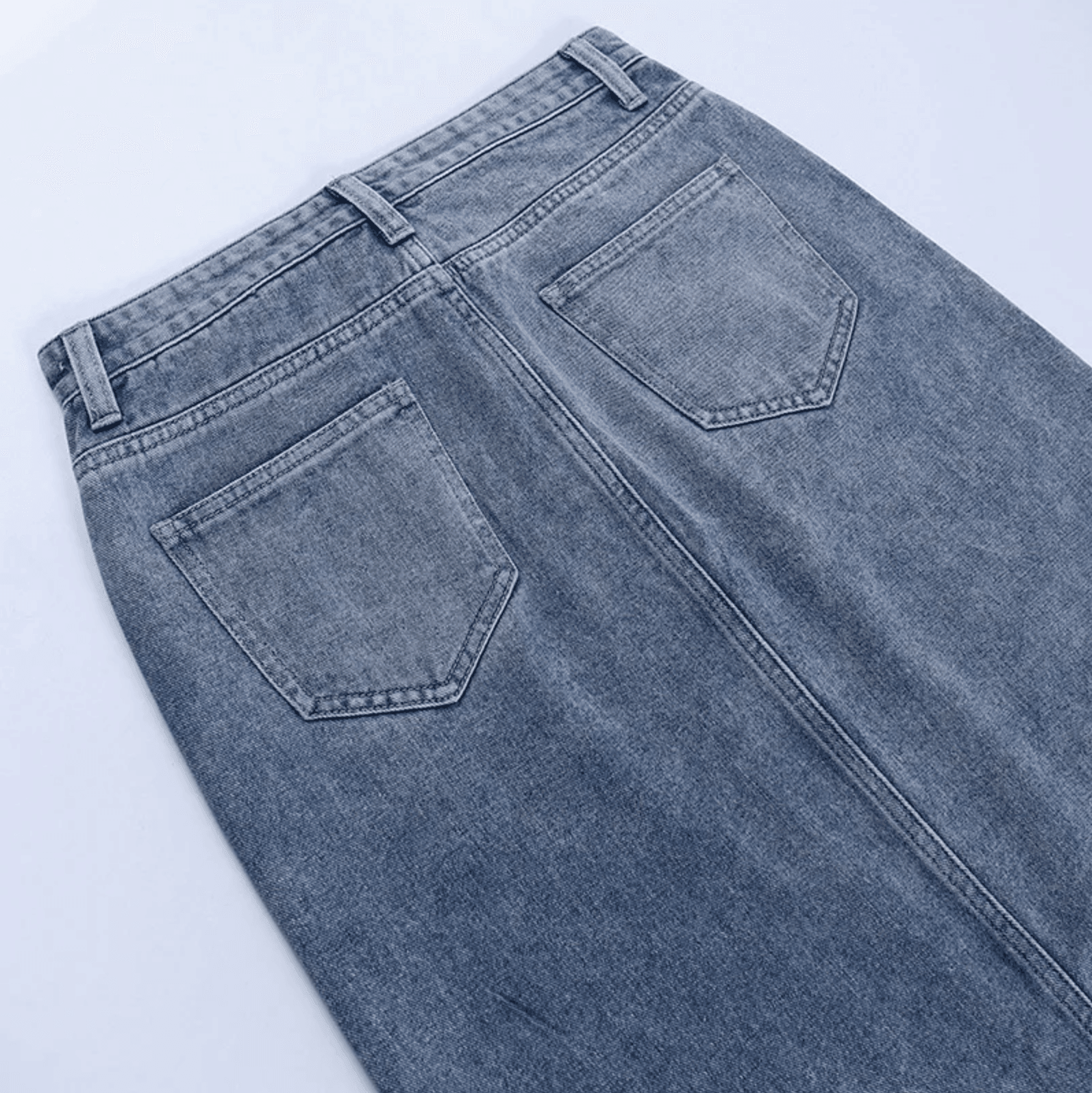 Denim midi skirt with back pockets and belt loops, casual daywear.