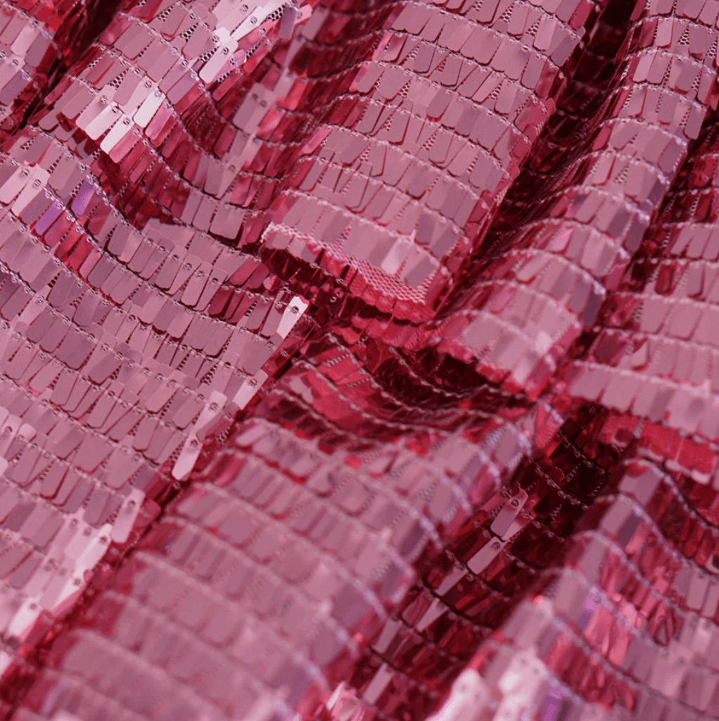 Red sequin fabric detail, ideal for party attire.