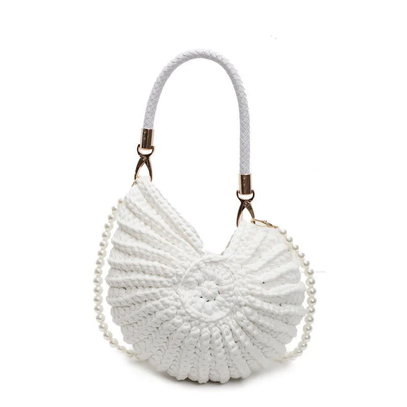 white crocheted seashell-shaped bag with pearl accents