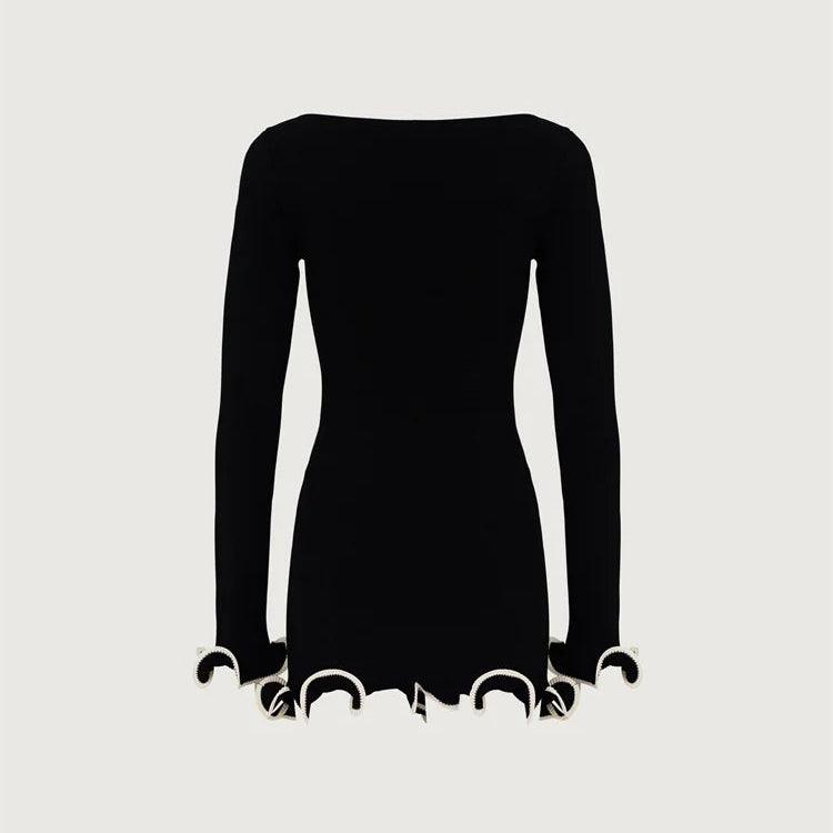 Black long-sleeve mini dress with scalloped edges, elegant evening wear