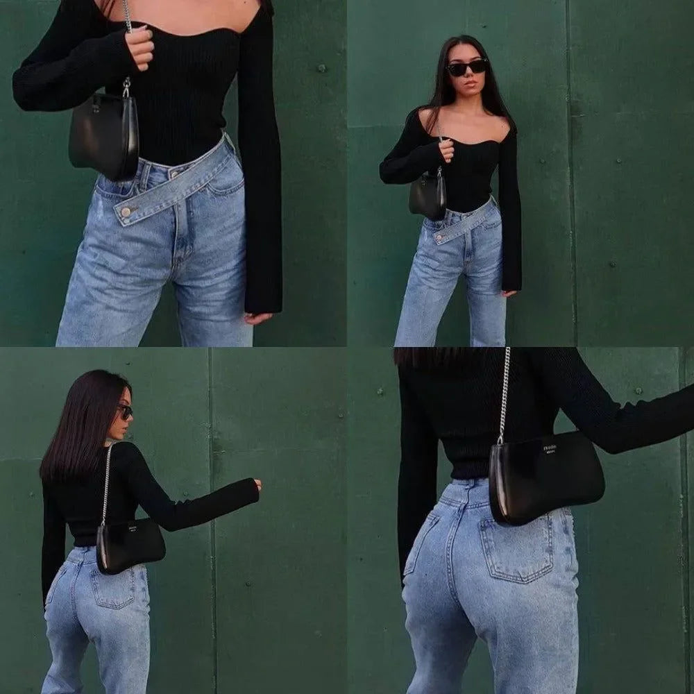 Black off-shoulder top with long sleeves paired with high-waisted jeans, casual chic ensemble