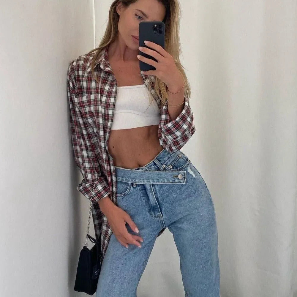 Plaid shirt over cropped white tank and high-waisted denim jeans, casual outfit.