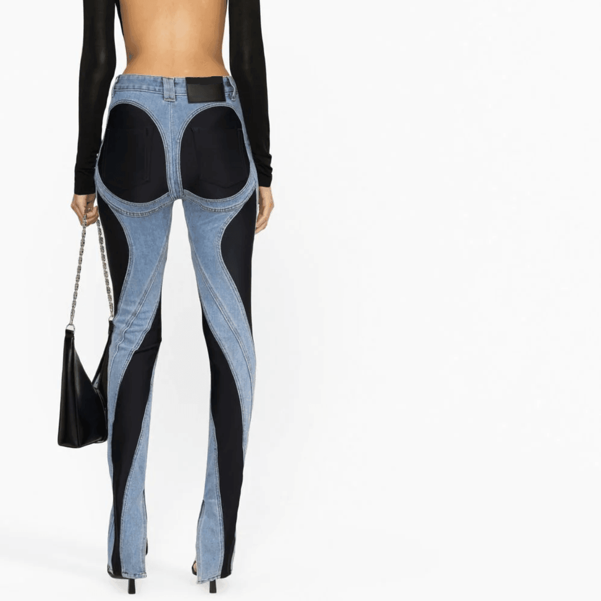 Flared denim and black patchwork pants, casual statement wear.