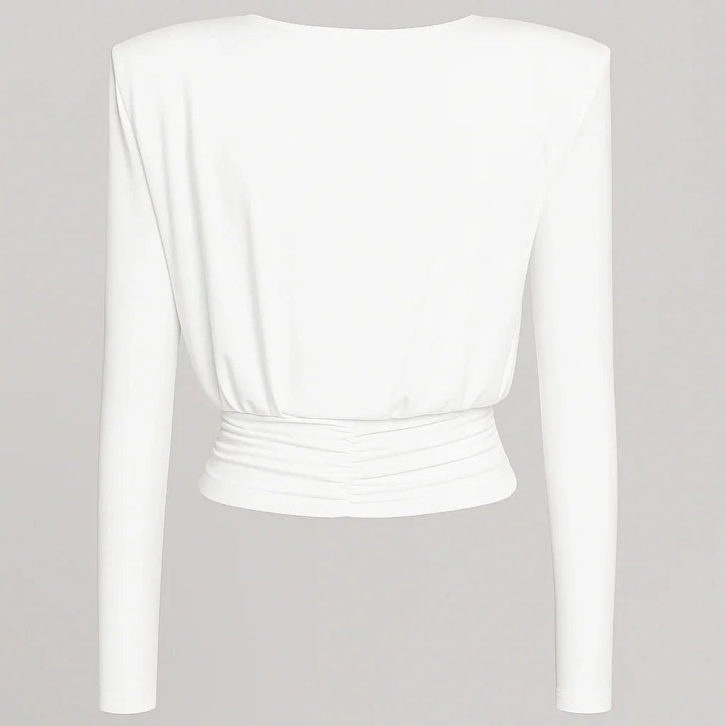 White long-sleeve top with ruched waist, elegant evening wear.