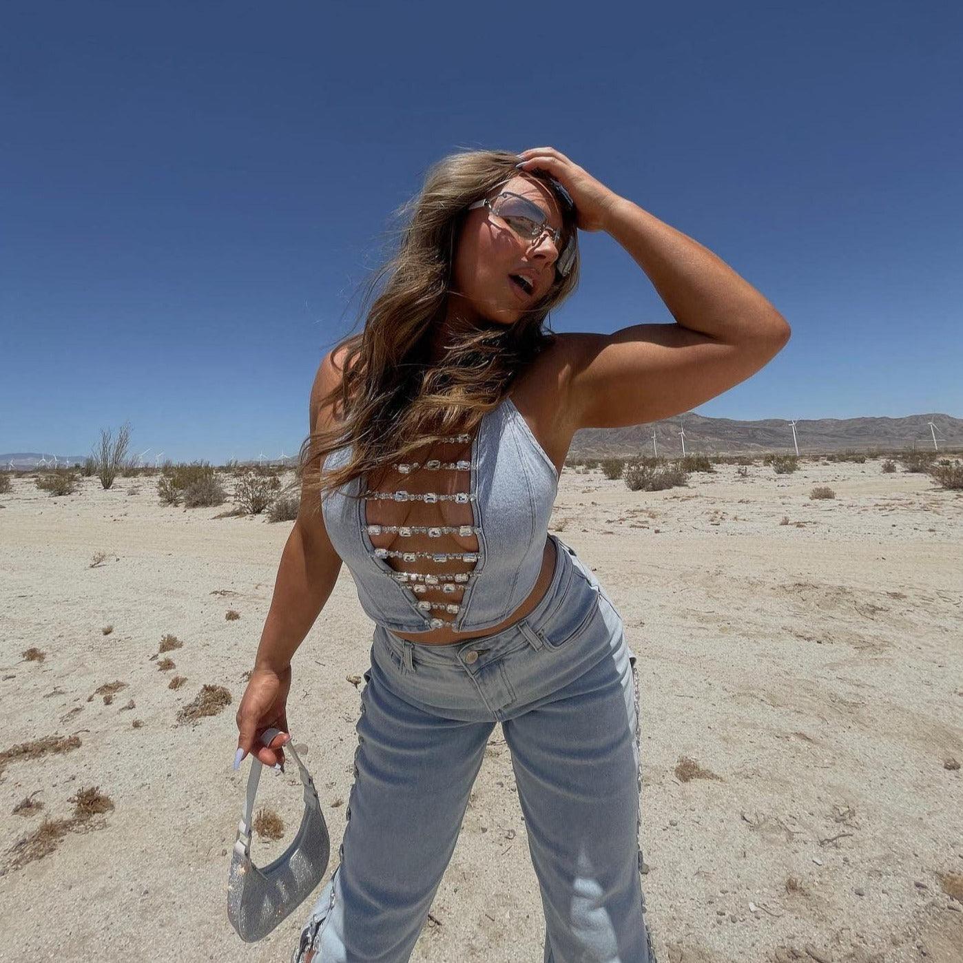 Denim lace-up crop top with bead details, casual daytime look.