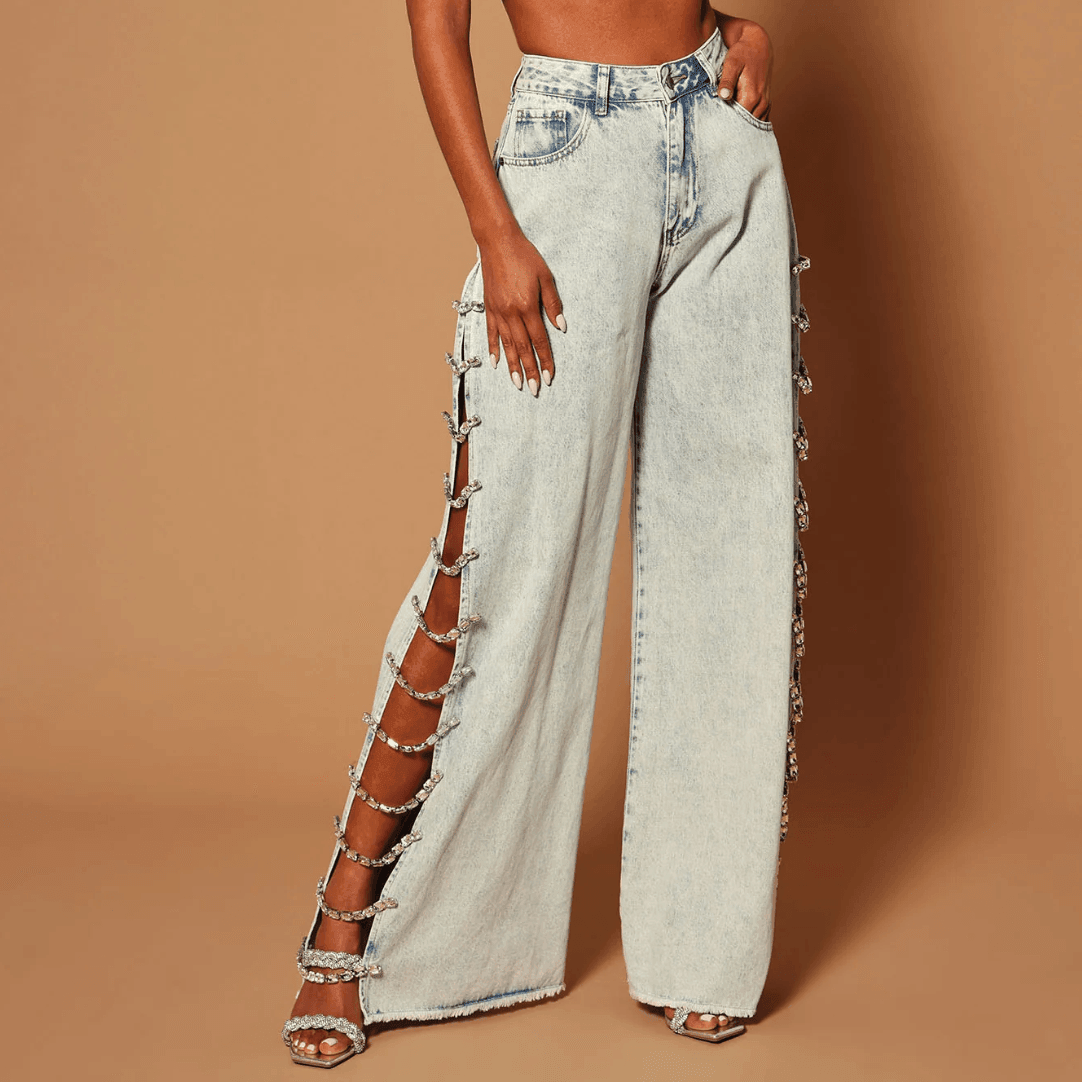 Baggy high-waisted jeans with side crystal embellishments, edgy statement style.