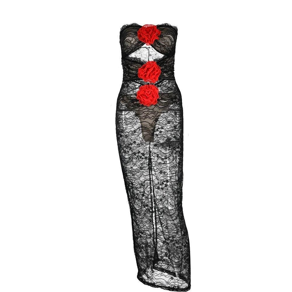 Sheer black lace strapless maxi dress with red floral accents, bold evening or party outfit.