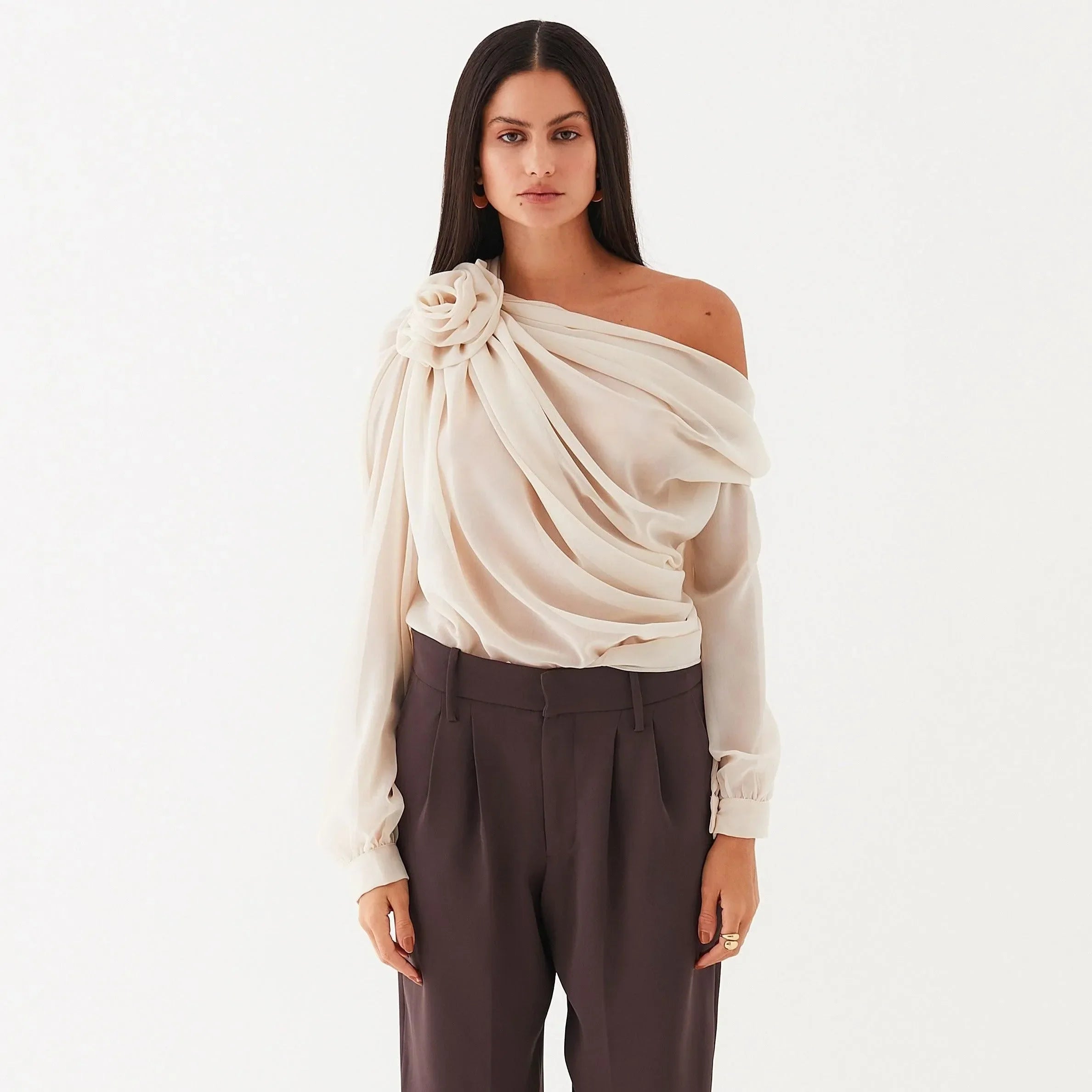 Flowy off-shoulder blouse with floral detail, elegant statement top