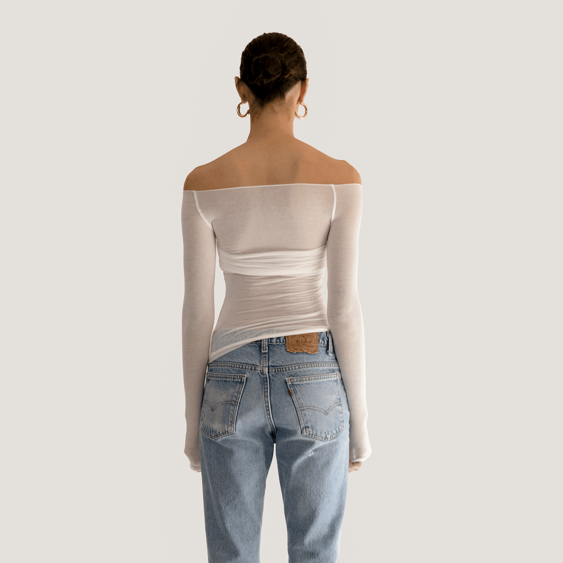 Off-shoulder sheer mesh long-sleeve top, casual style.