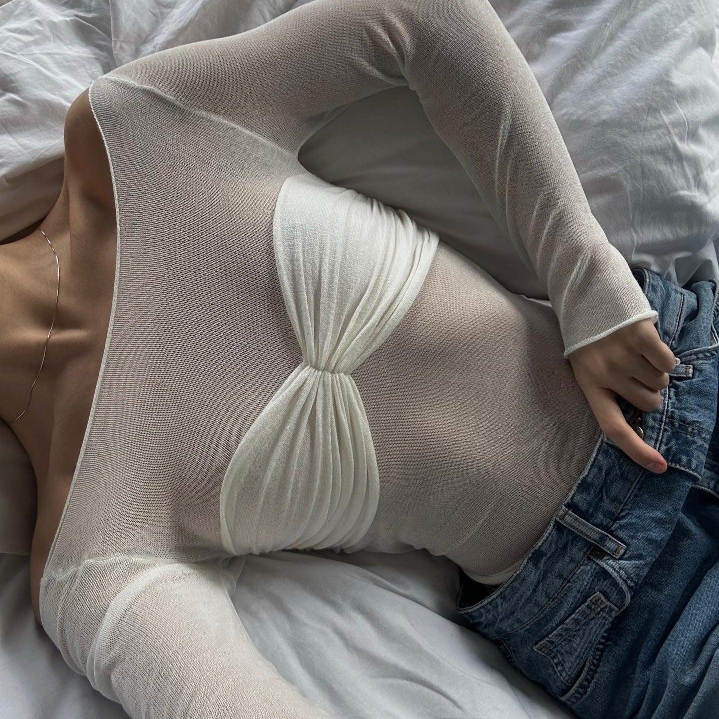 Sheer off-shoulder mesh top layered over ruched bandeau, casual styling