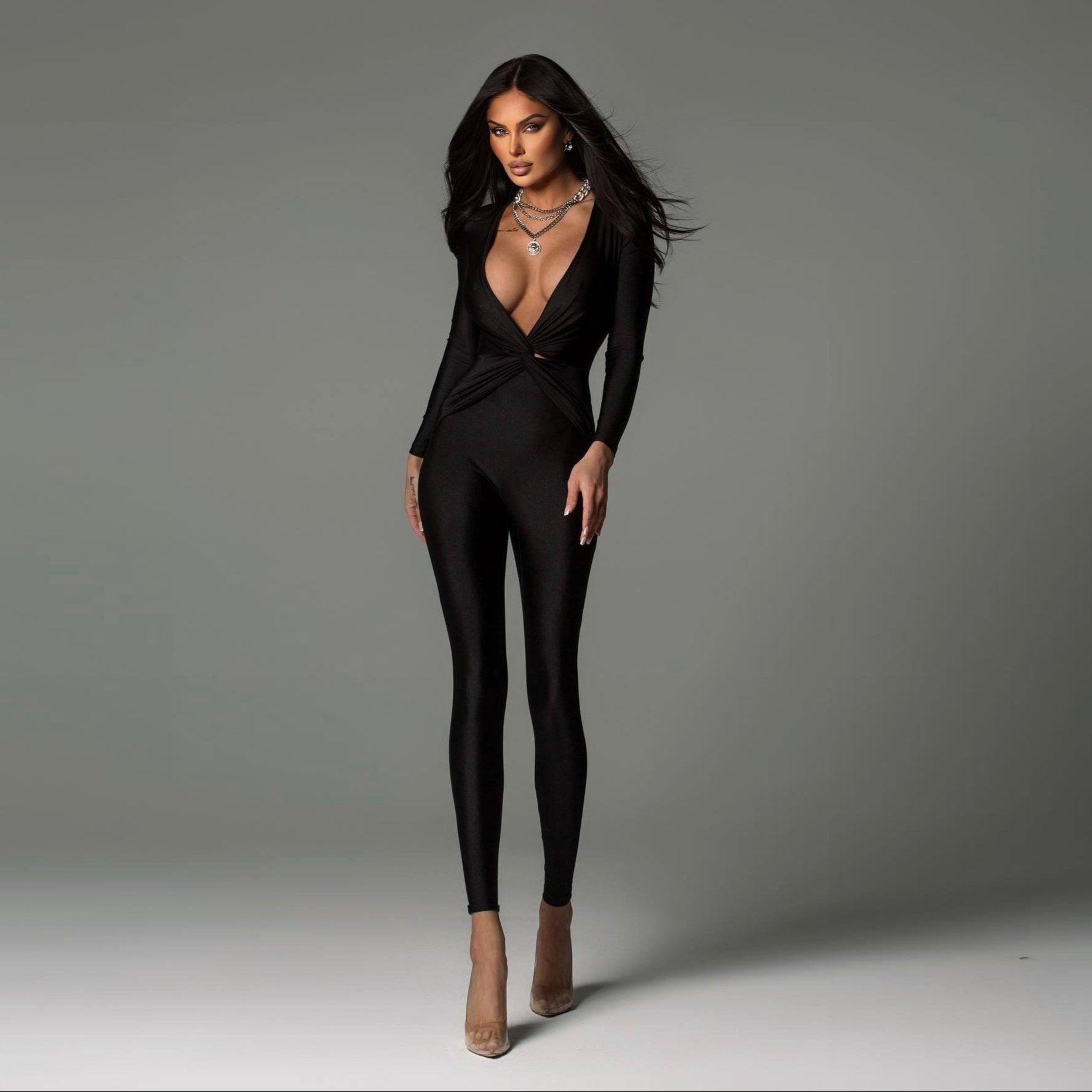 Form-fitting black jumpsuit with a deep V-neckline, sleek night-out style