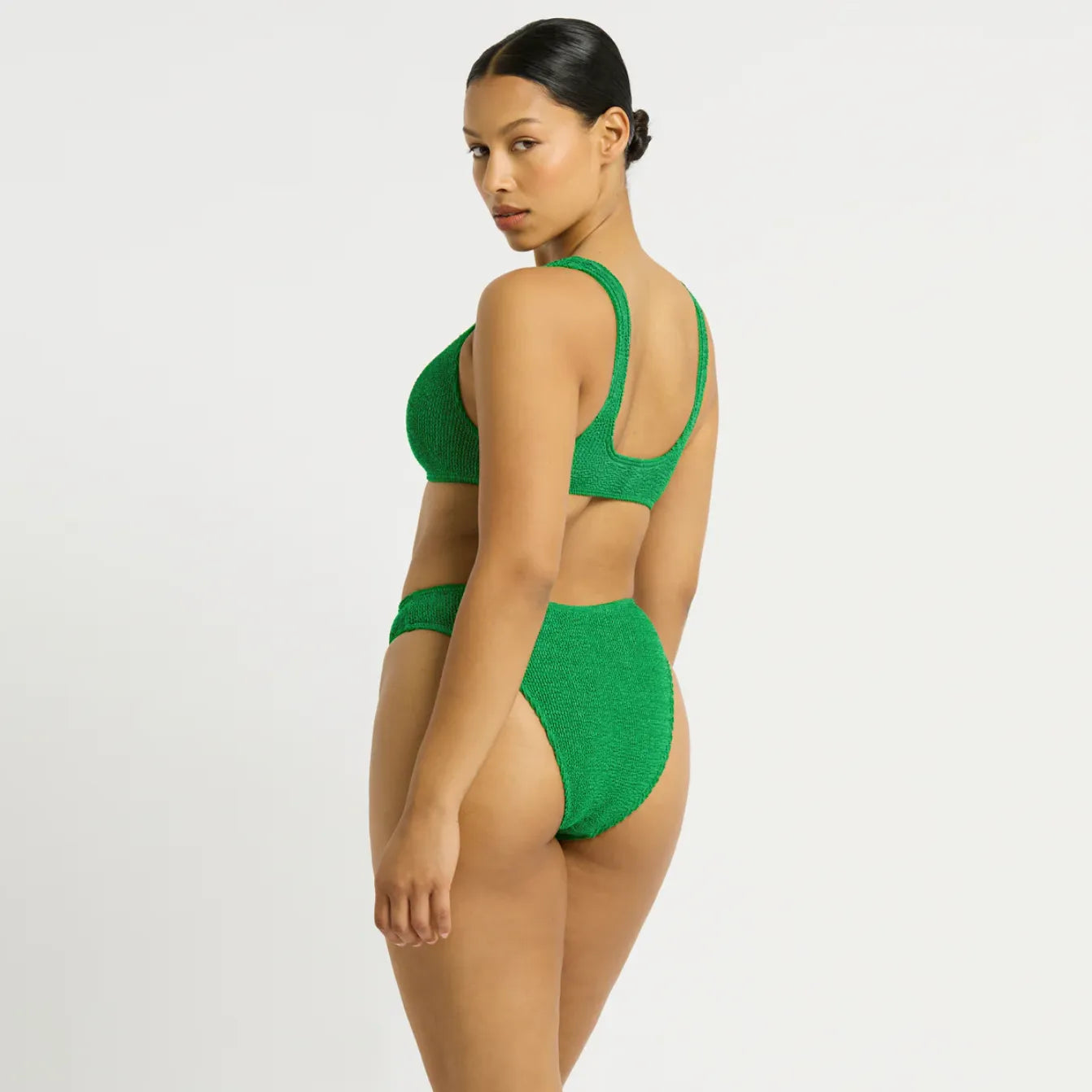 Textured green bikini set with high-waisted bottom, beachwear ensemble