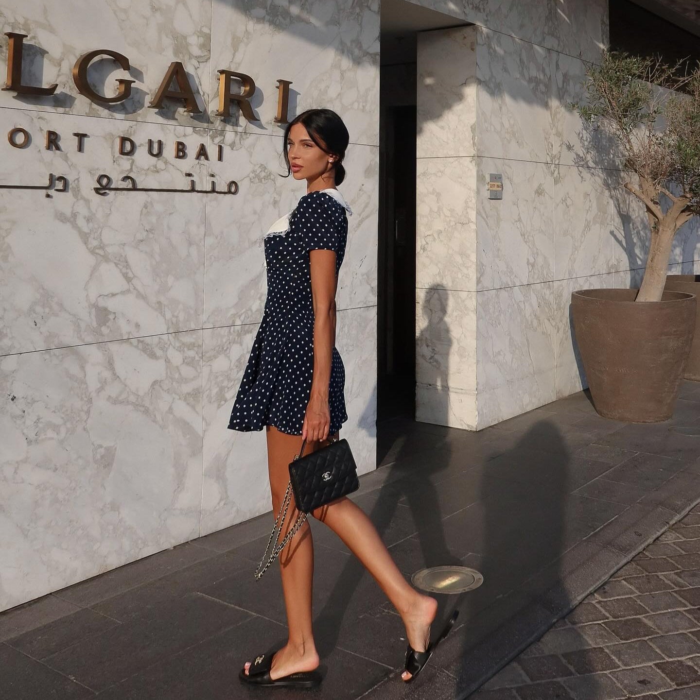 Polka dot mini dress with contrast collar, casual daywear style.