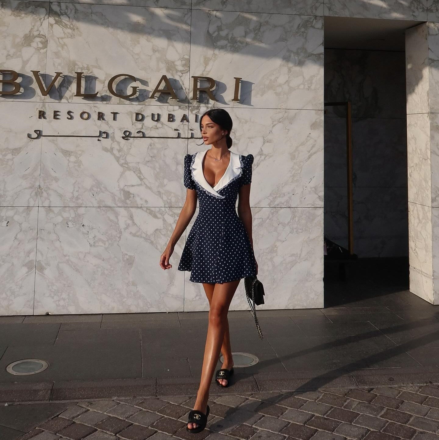 Polka dot mini dress with white collar and puff sleeves, chic daytime style