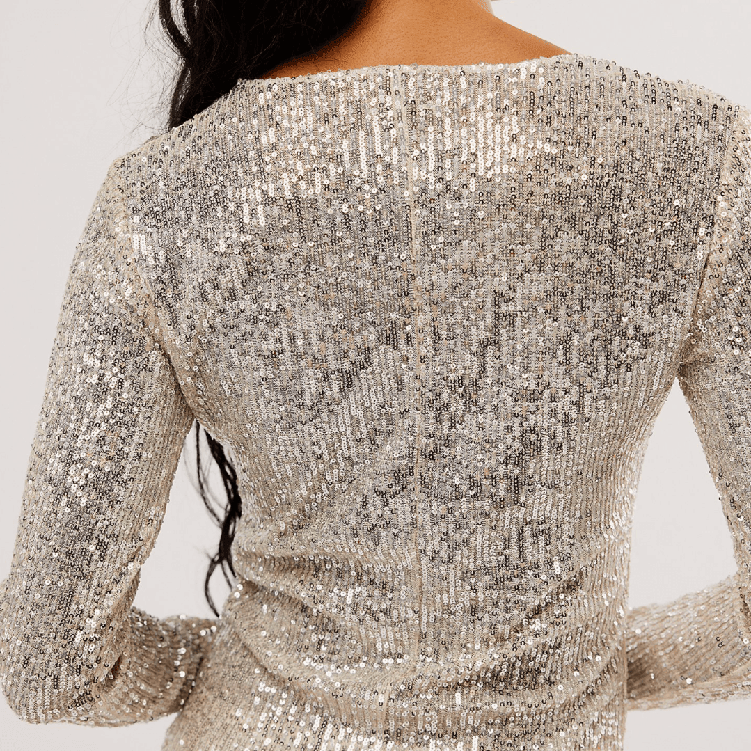 Sequin long-sleeve top, sparkling evening wear.