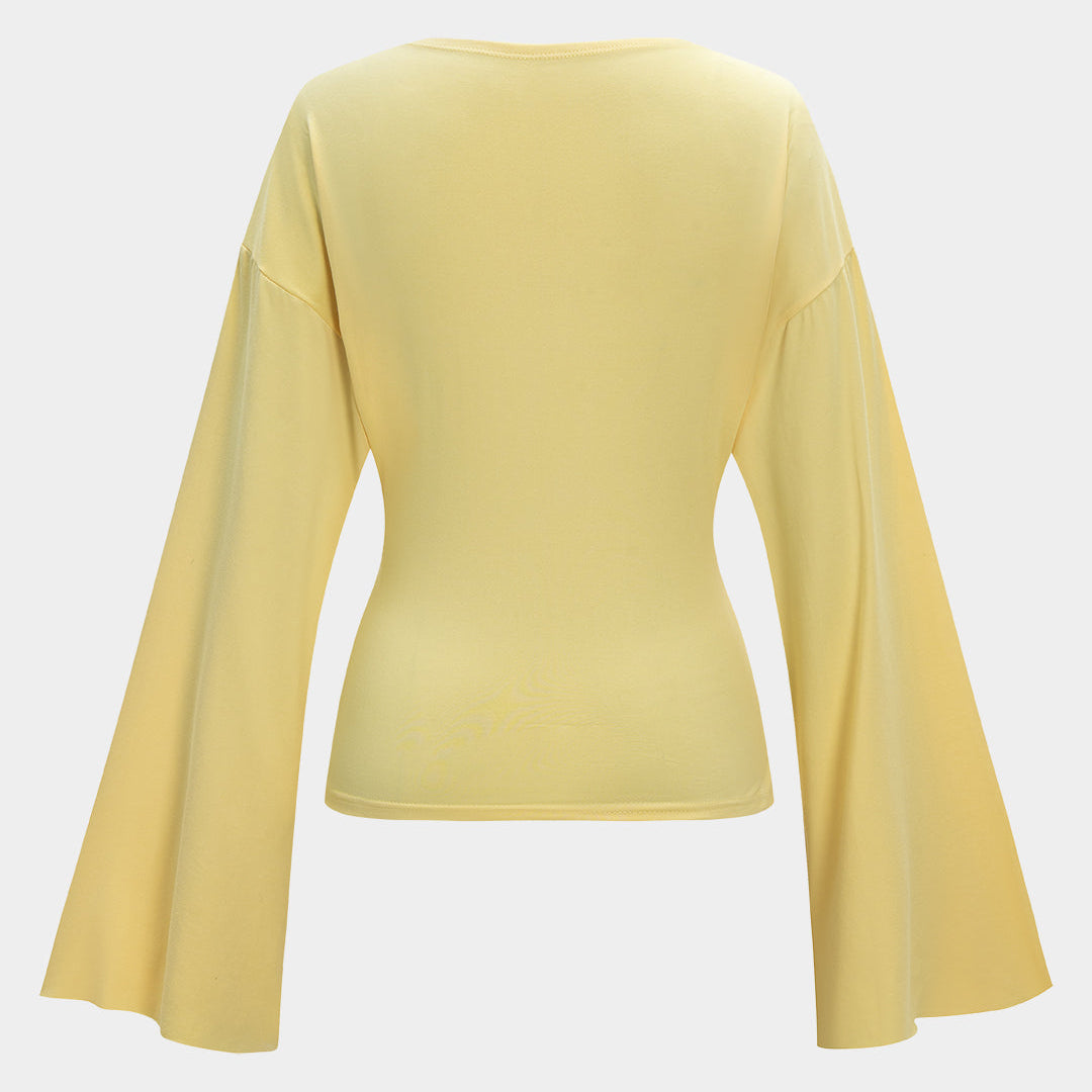 Yellow long-sleeve top with wide bell sleeves.