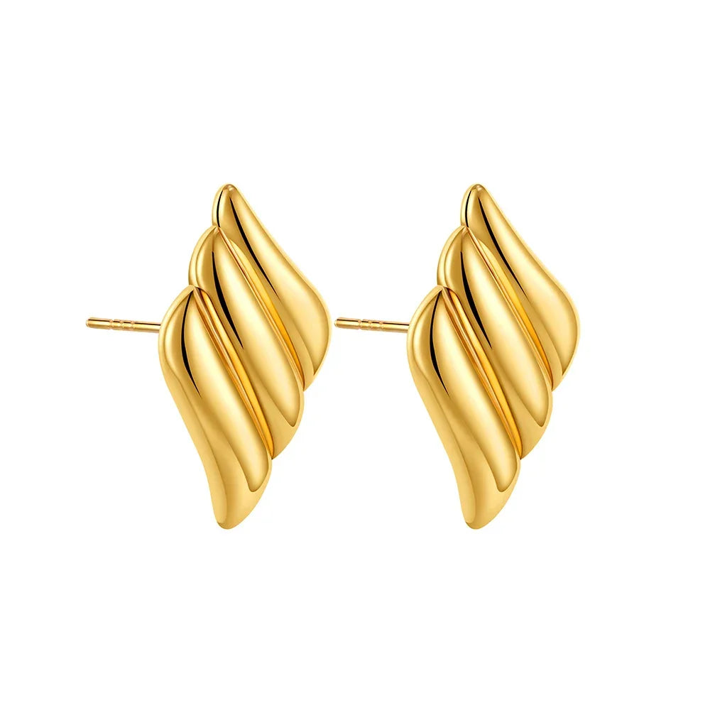 Gold twisted earrings, chic accessory.