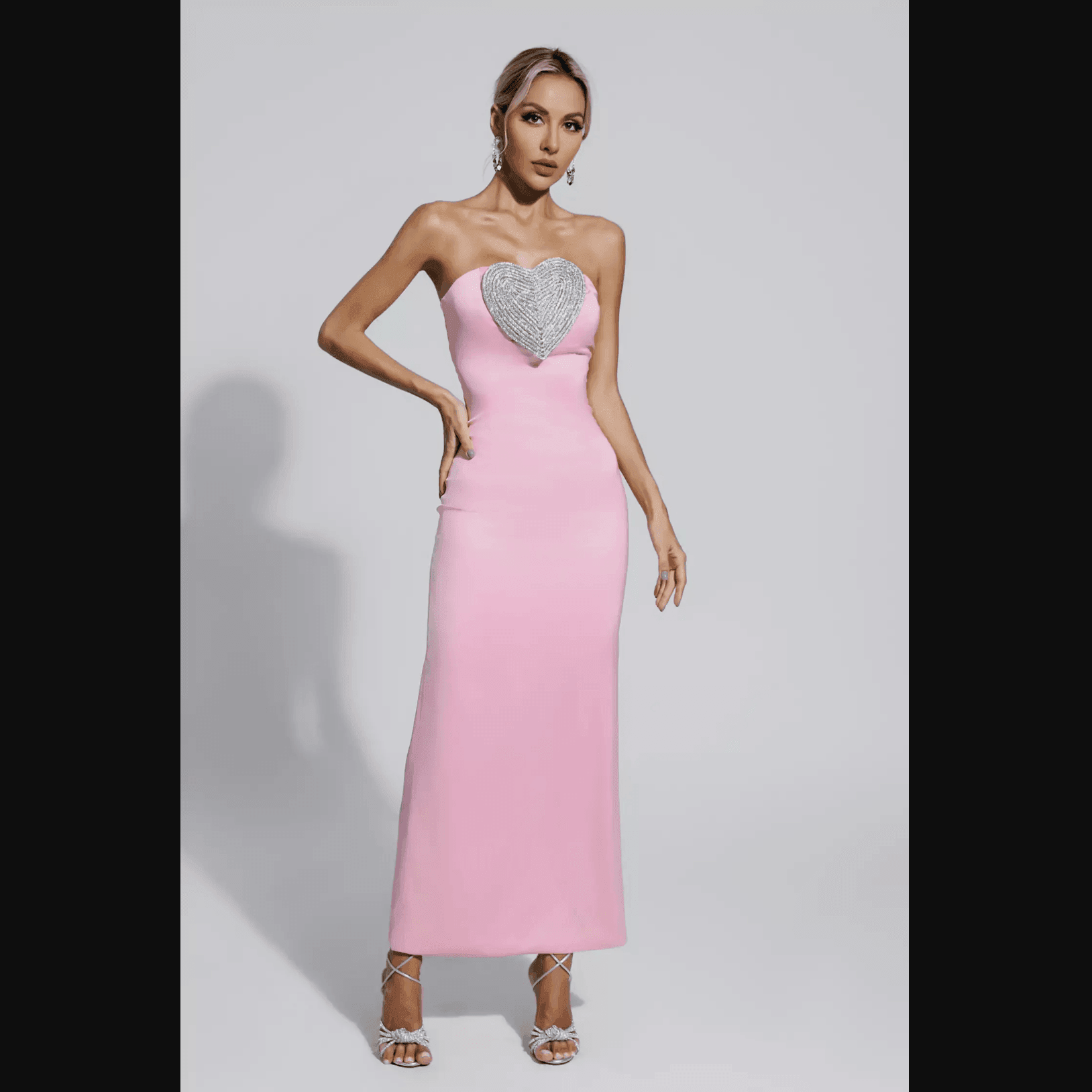 Strapless pink maxi dress with heart embellishment, elegant evening outfit