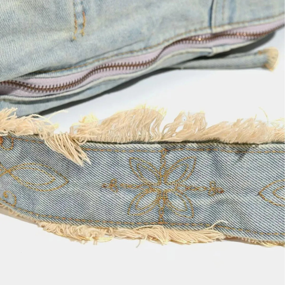 frayed denim with floral embroidery