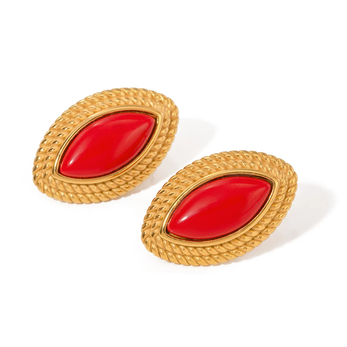 Gold-tone earrings with red enamel detailing, statement accessory.