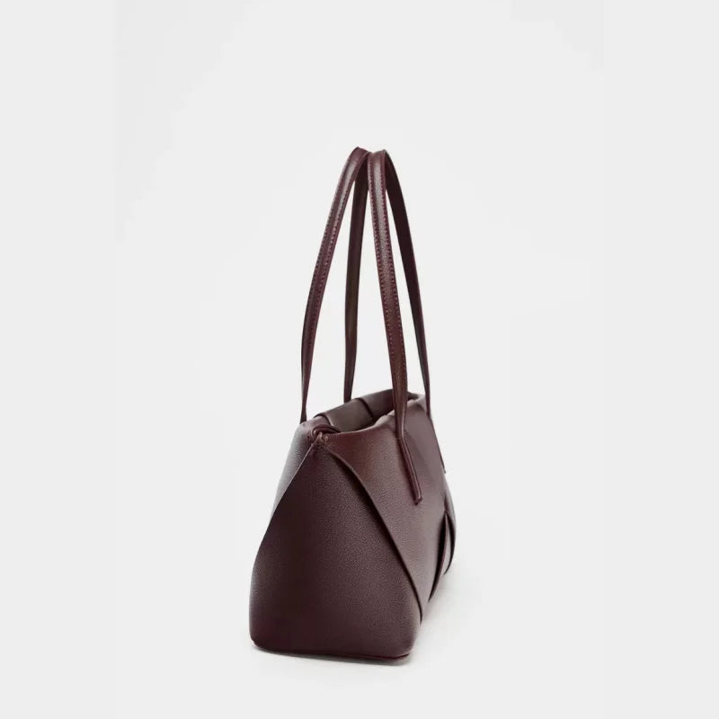 Brown leather tote bag with structured design, versatile accessory