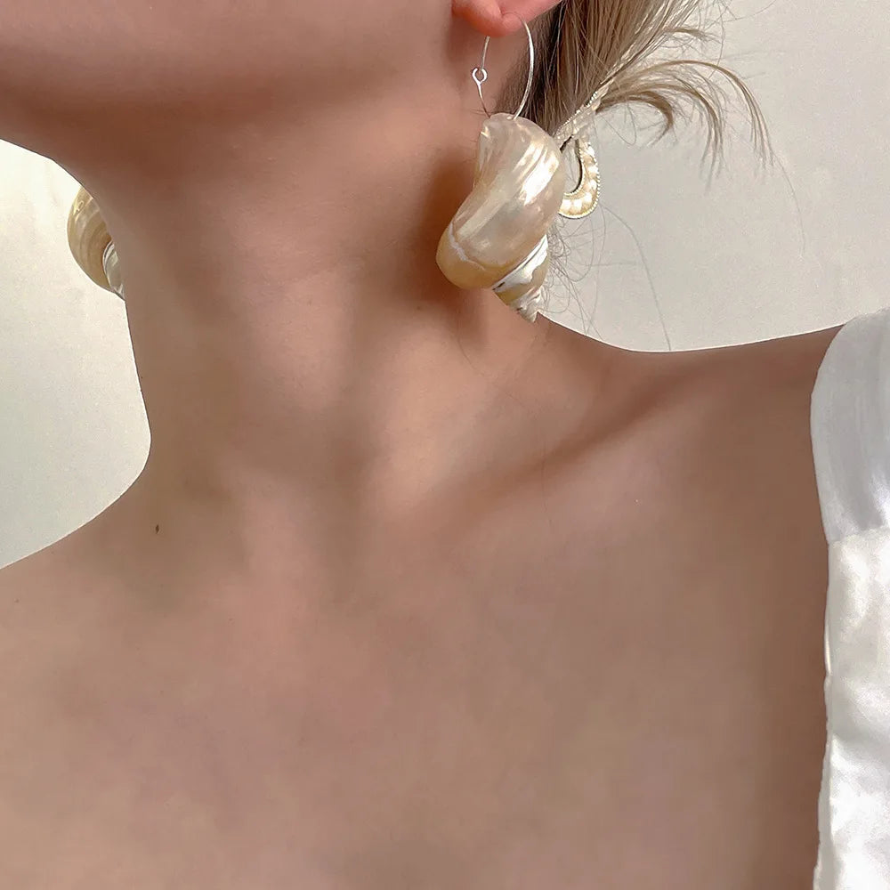 Pearl-inspired statement earrings.