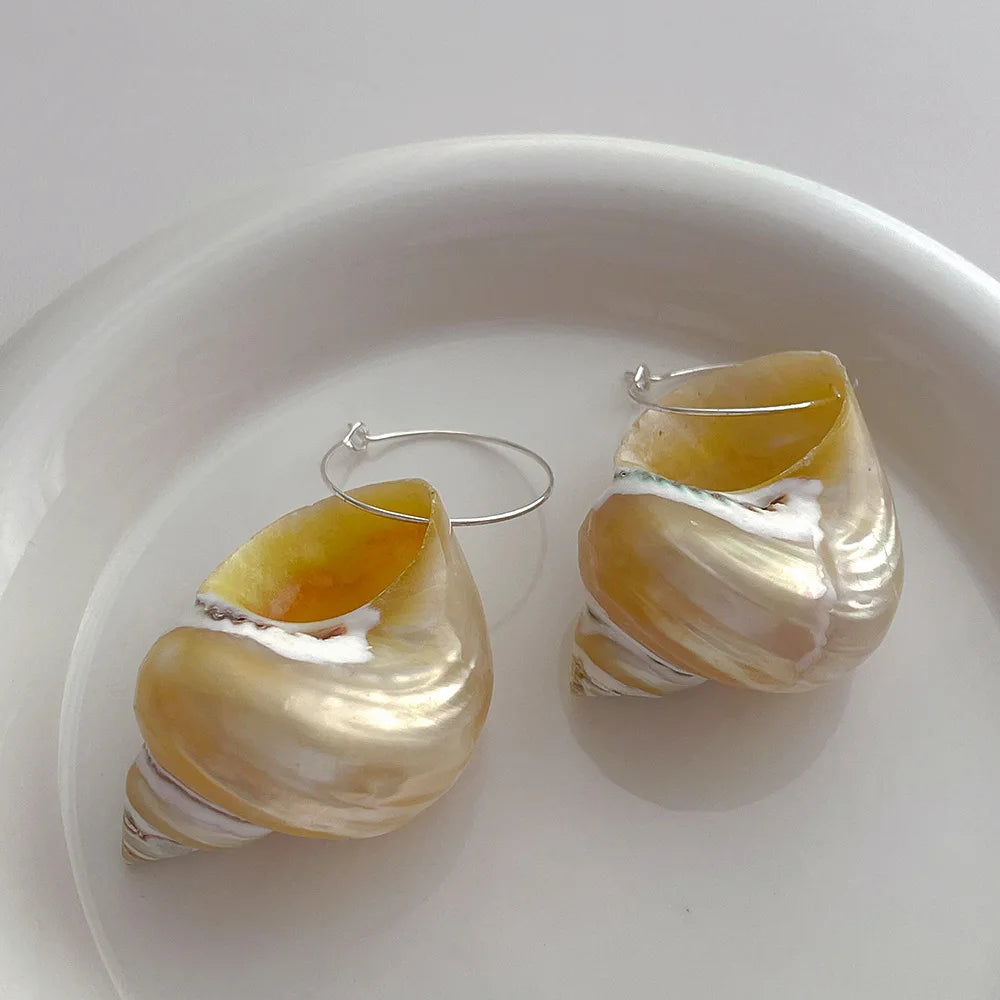 Shell hoop earrings with iridescent finish, beach-inspired accessory