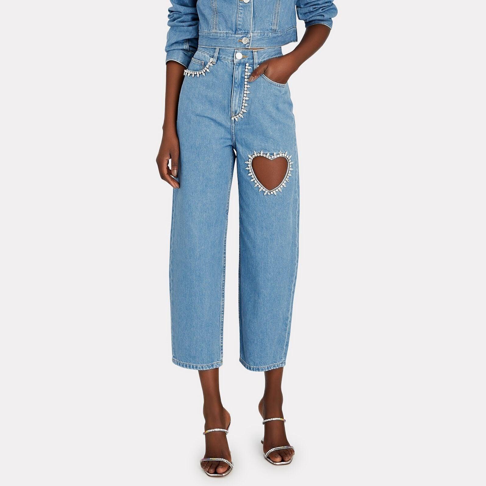 Heart cutout embellished jeans with casual daytime styling.