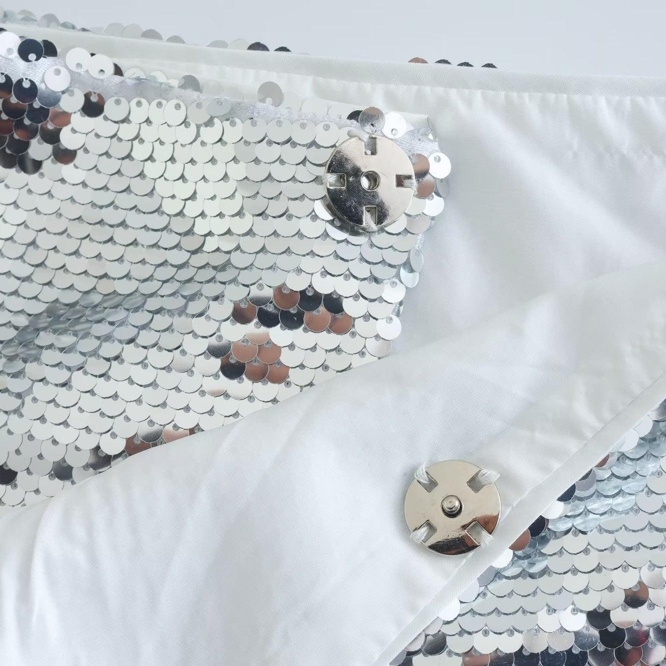 Sequin-embellished fabric detail with magnetic closure, glamorous party accessory.