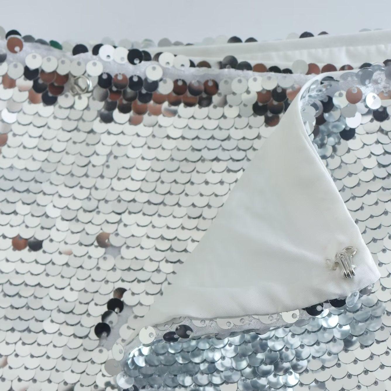 Sequin fabric with metallic finish, ideal for party and evening wear.
