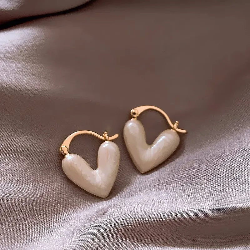 heart-shaped earrings with gold detailing
