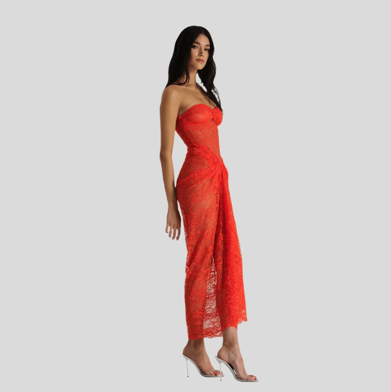 Orange lace off-shoulder maxi dress with figure-hugging silhouette, styled with strappy heels for an elegant look.