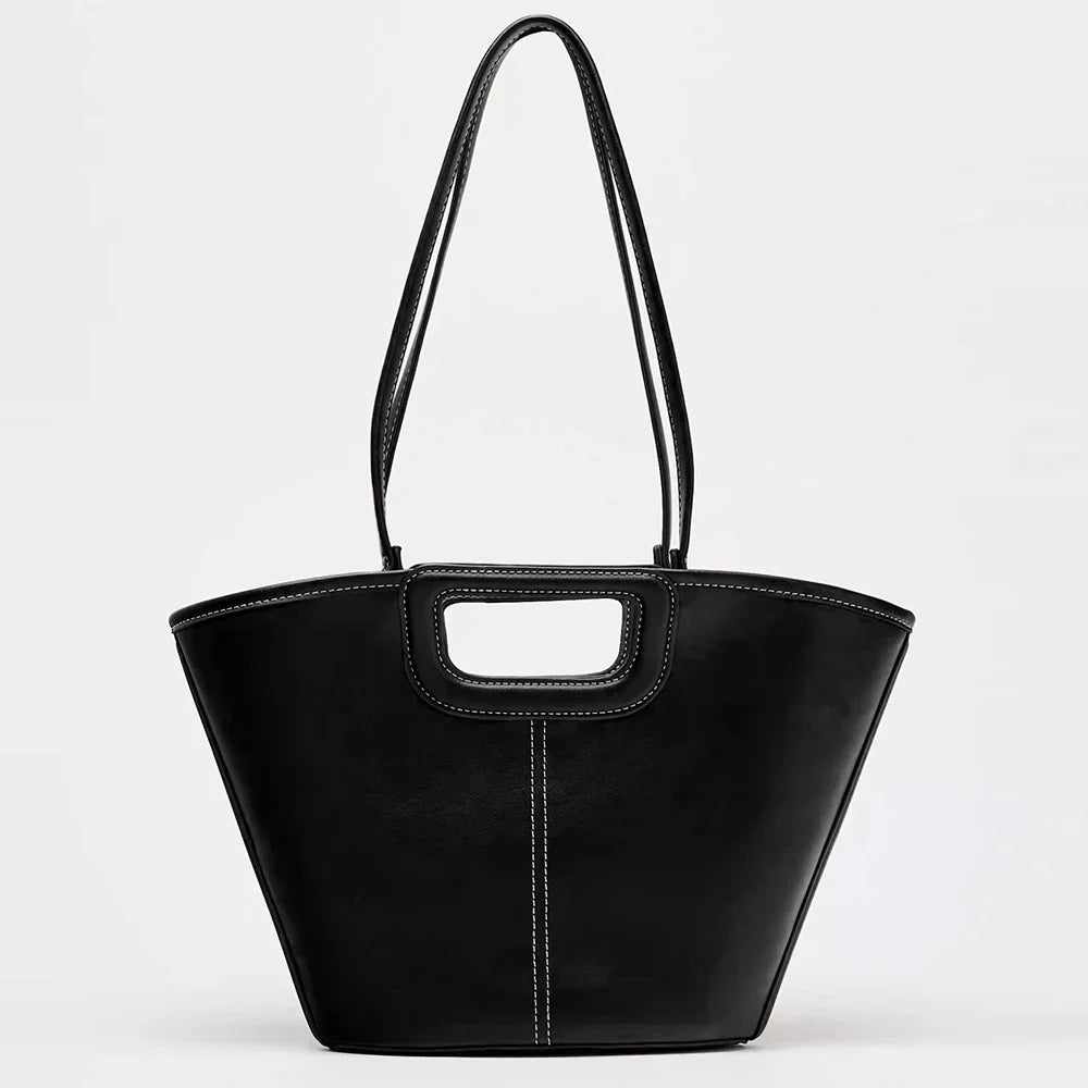 black leather tote bag with cutout handle