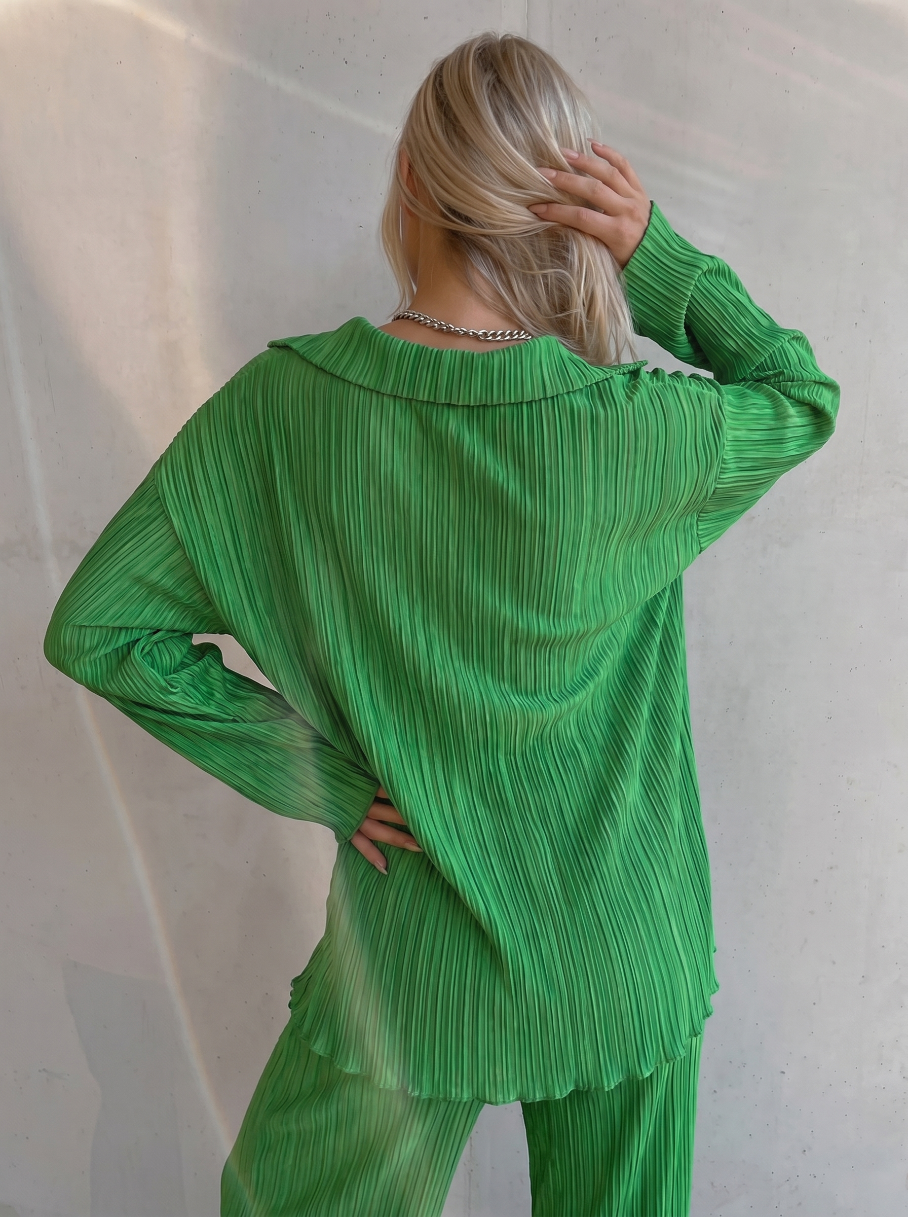 green pleated co-ord set with oversized shirt and wide-leg pants