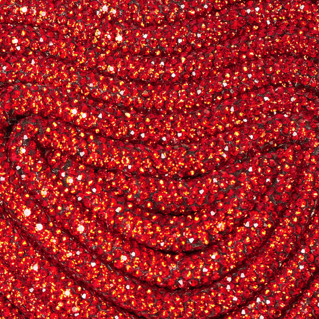 Red sequin fabric with a shimmering effect.