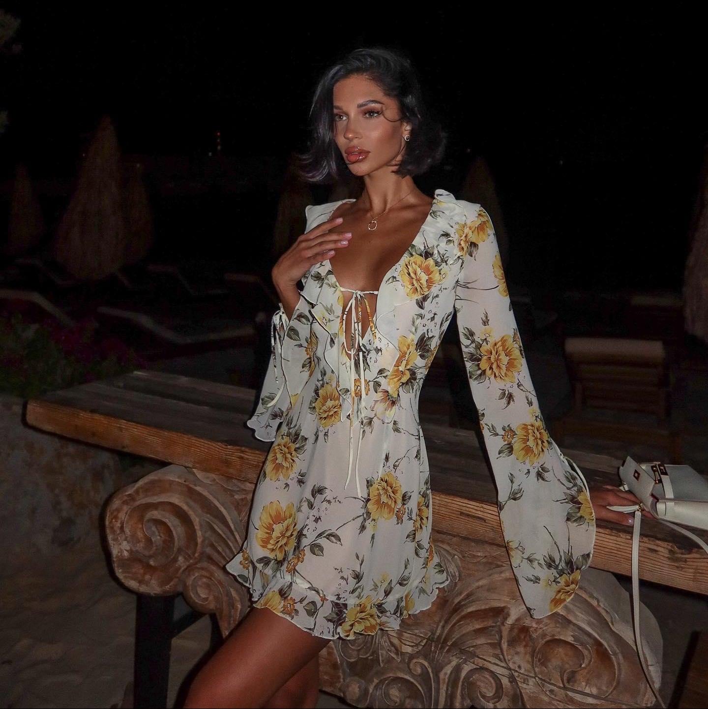 Floral chiffon mini dress with long sleeves, perfect for an evening look.