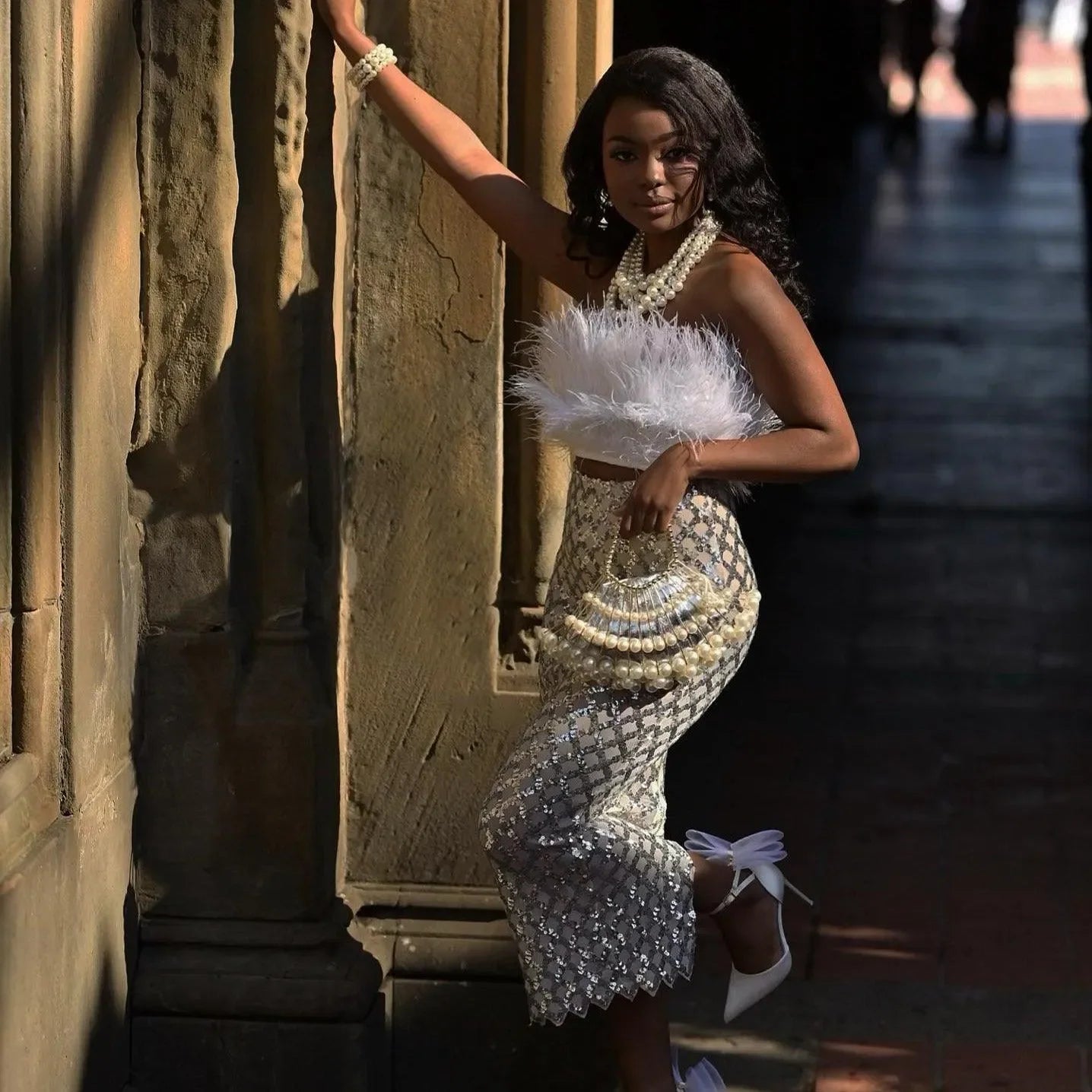 feather top with pearl embellishments and sequin skirt, elegant evening ensemble