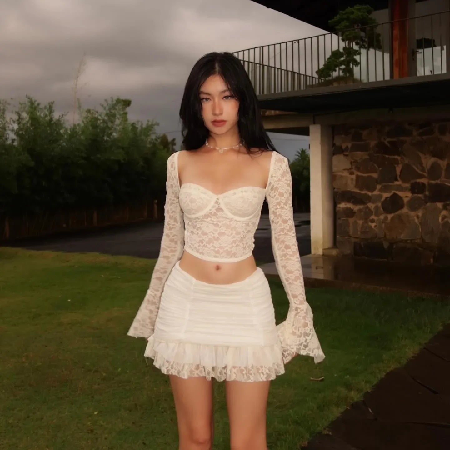 Lace long-sleeve top with matching ruched mini skirt, party outfit