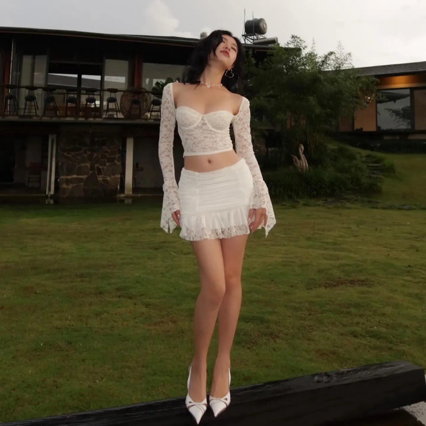 Lace long-sleeve top with matching ruched mini skirt, evening look