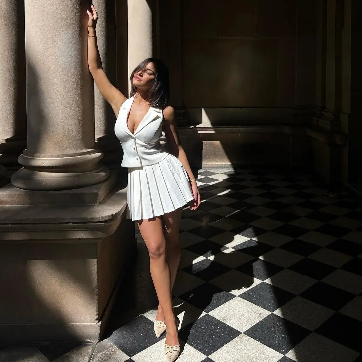 pleated mini skirt and tailored top set, daytime look