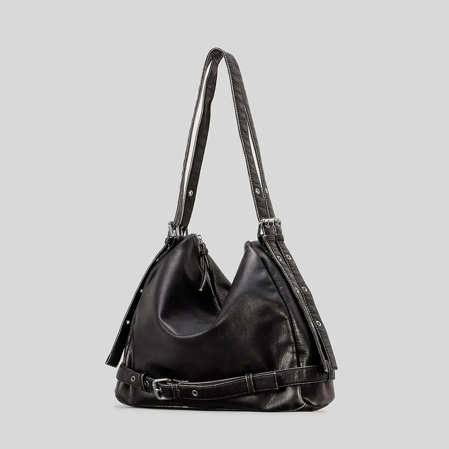 black leather tote bag with studded straps